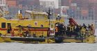 Sailors trapped underwater in capsized tugboat