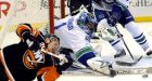 Islanders sink Canucks in shootout
